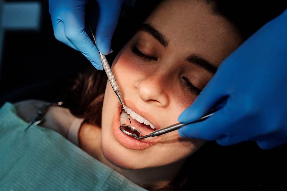 Dentist examining a patient’s mouth during a clinical oral checkup