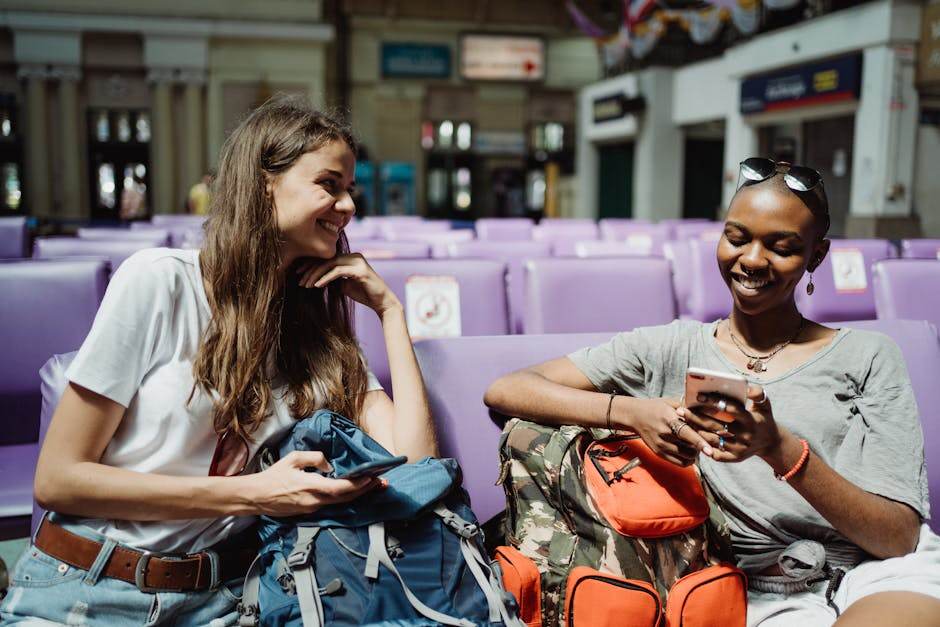 Person packing a USB-C charger and laptop for travel