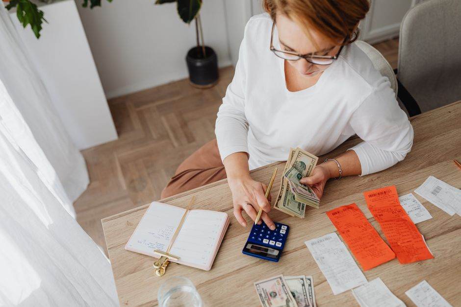 French household reviewing electricity bill and budget at home