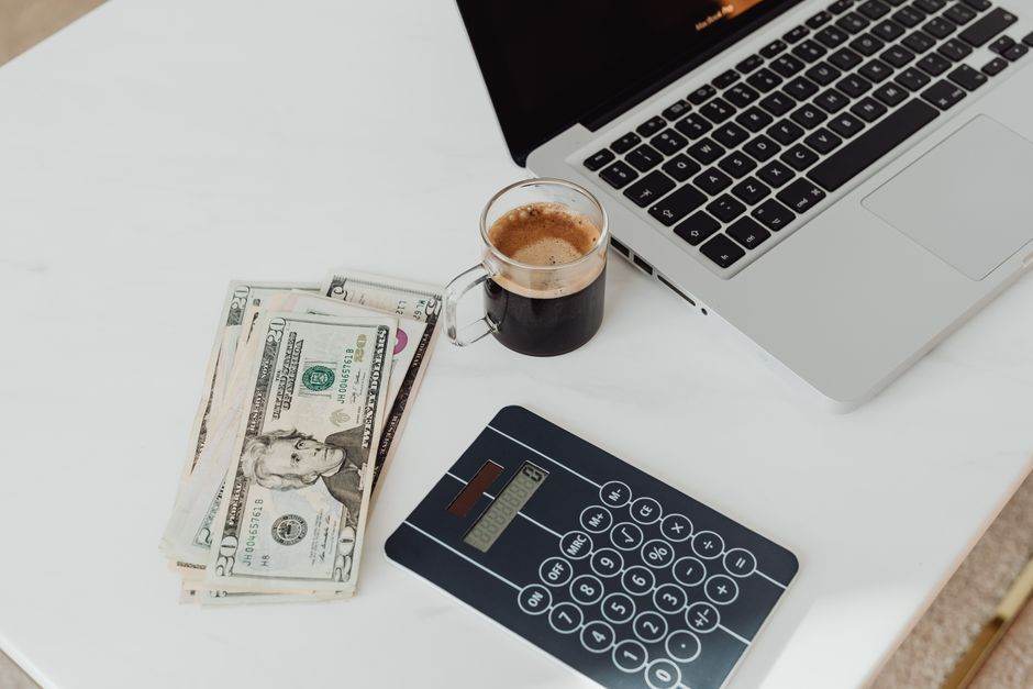 Person comparing energy prices on a laptop at home