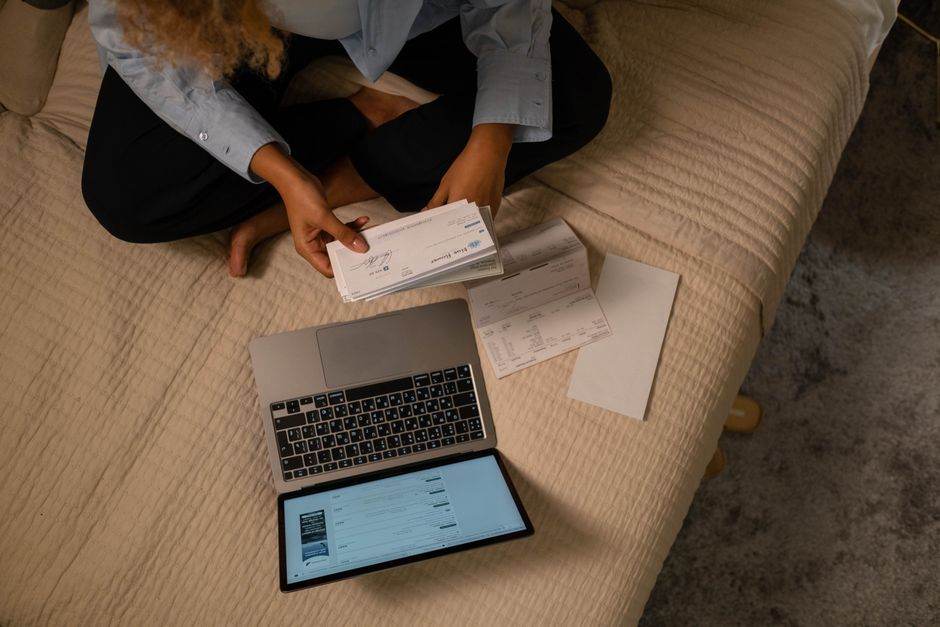 Person comparing utility bills and energy offers at home