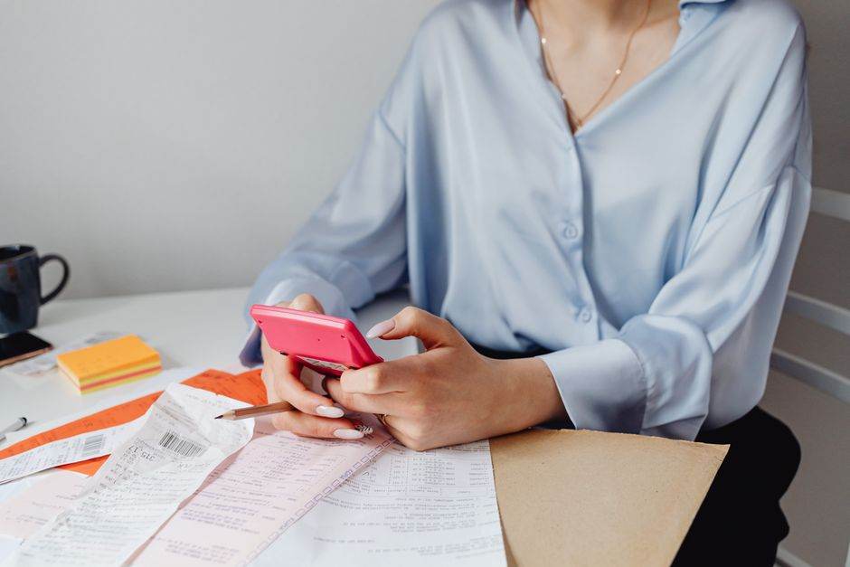 Gas bill and calculator on a kitchen table