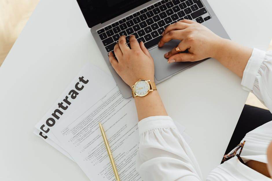 Person comparing energy contract offers on laptop