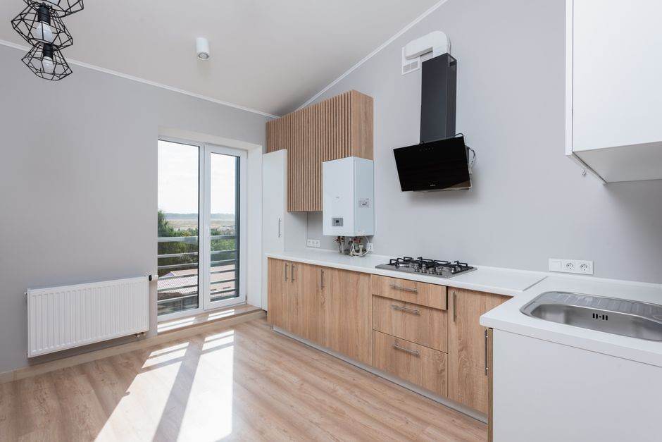 Smart thermostat and gas heating controls in a contemporary home interior