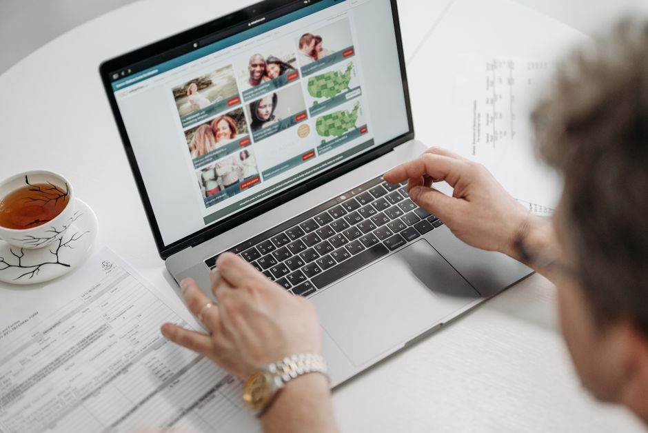 Person using a laptop to compare energy prices online