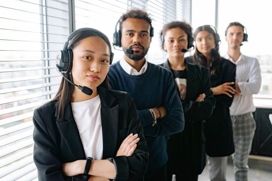 Customer service representative with headset in an office