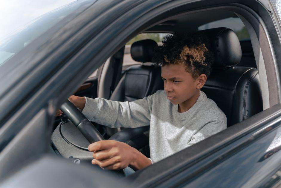Driving school learner practicing road signs on a tablet