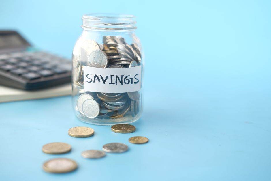 French savings books and coins arranged on a desk
