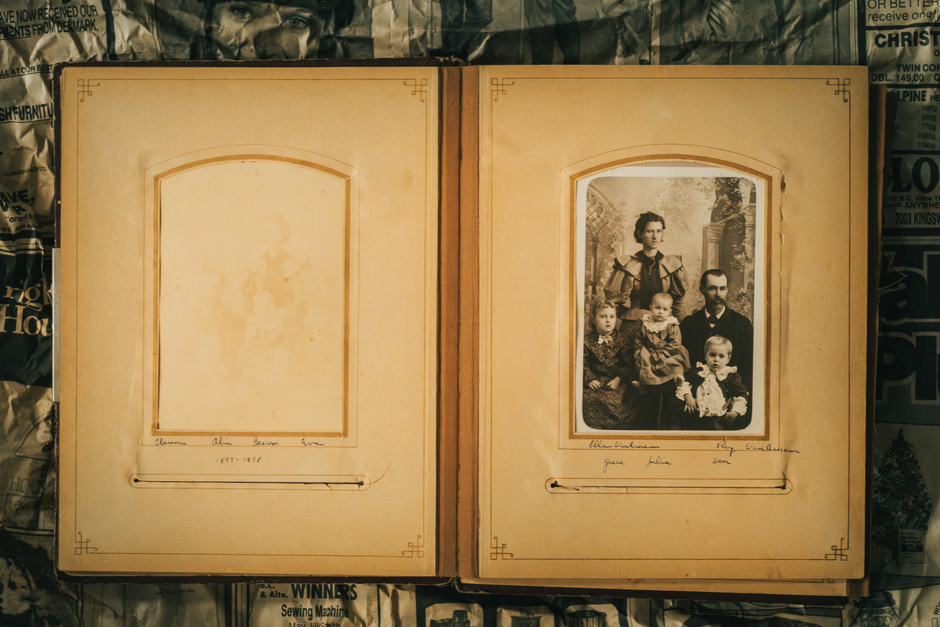A nostalgic look at a vintage family photo album featuring sepia tones and historical family portraits.