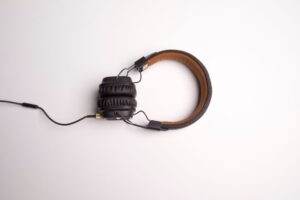 Minimalist image of black over-ear headphones on a white background.