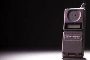 Classic Motorola flip phone on a dark background, highlighting its retro charm.