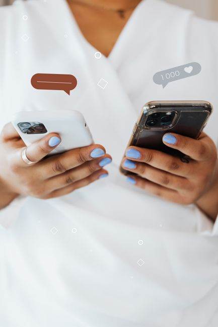 Close-up of person holding two smartphones, symbolizing modern communication trends.