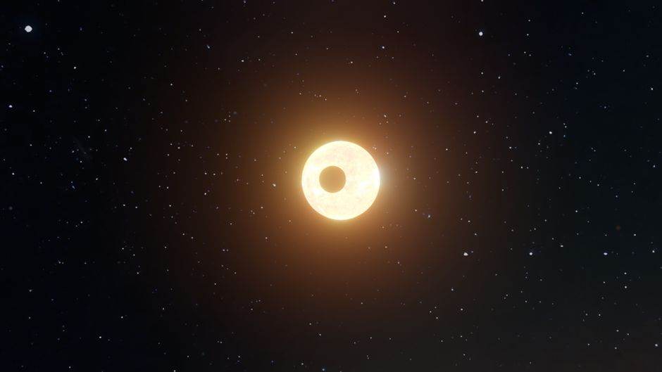 Une étoile verte existe, mais le terme Green Star recouvre quatre domaines A captivating view of a solar eclipse set amidst a star-filled night sky.