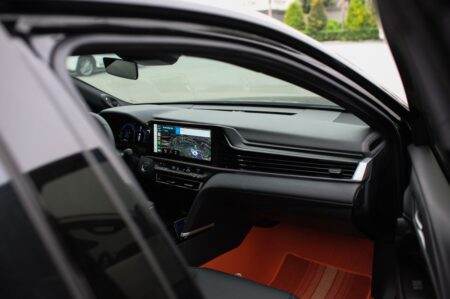 Interior view of a modern car showcasing a GPS navigation system on the dashboard screen.